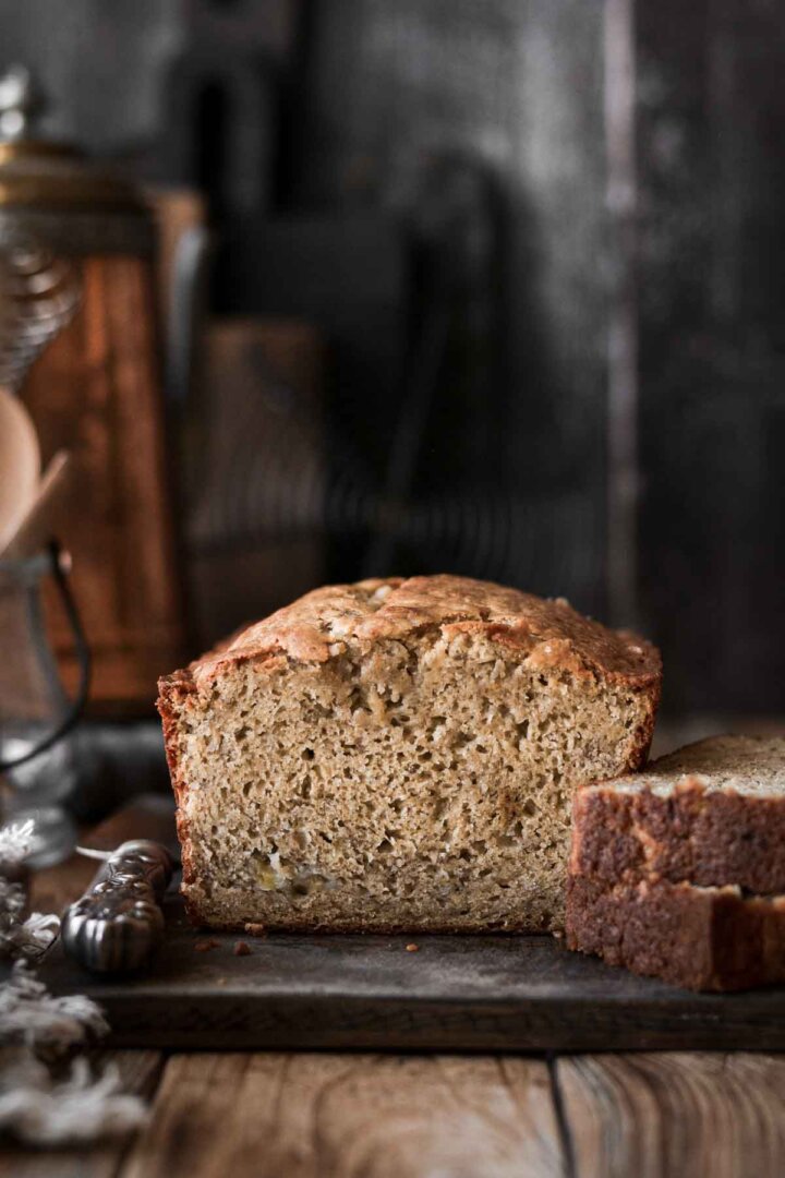 Banana bread with a slice cut.