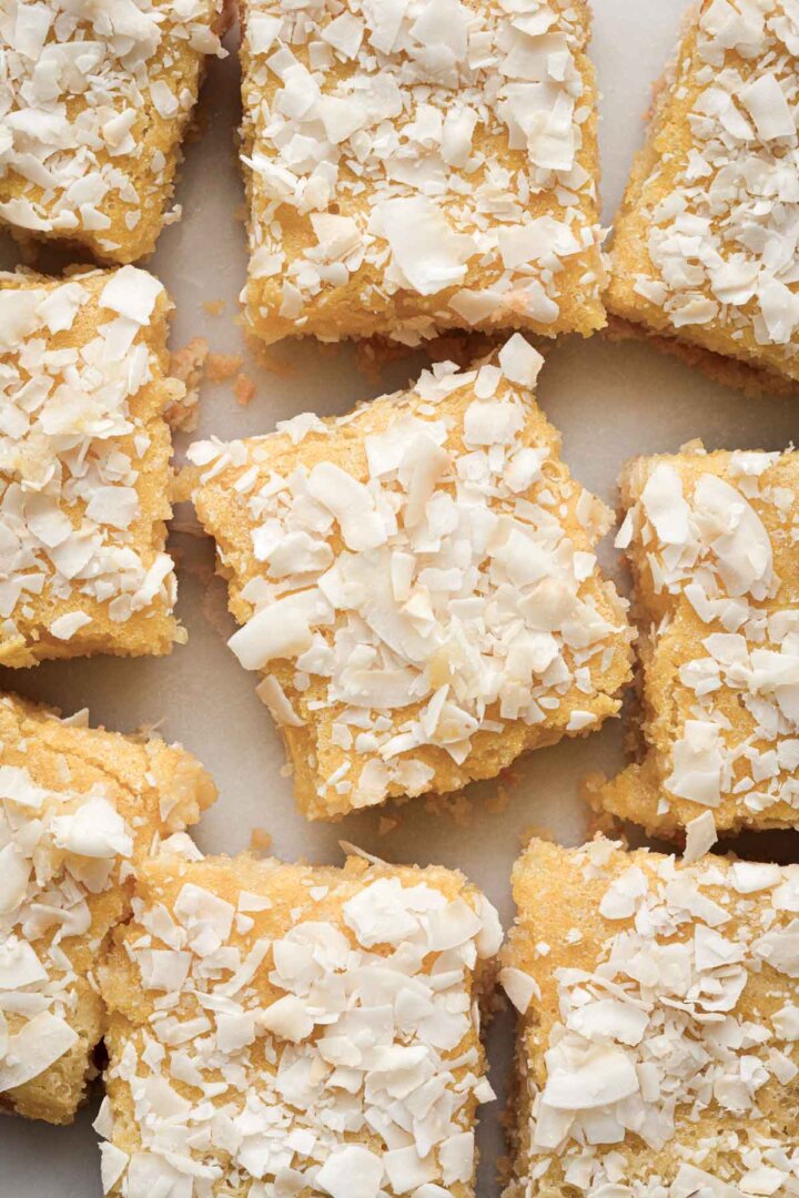 Coconut lemon bars cut into squares.
