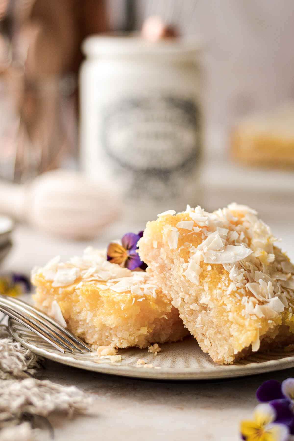 Coconut lemon bars on a plate.