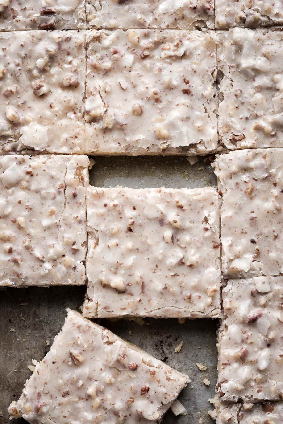Squares of white Texas sheet cake.