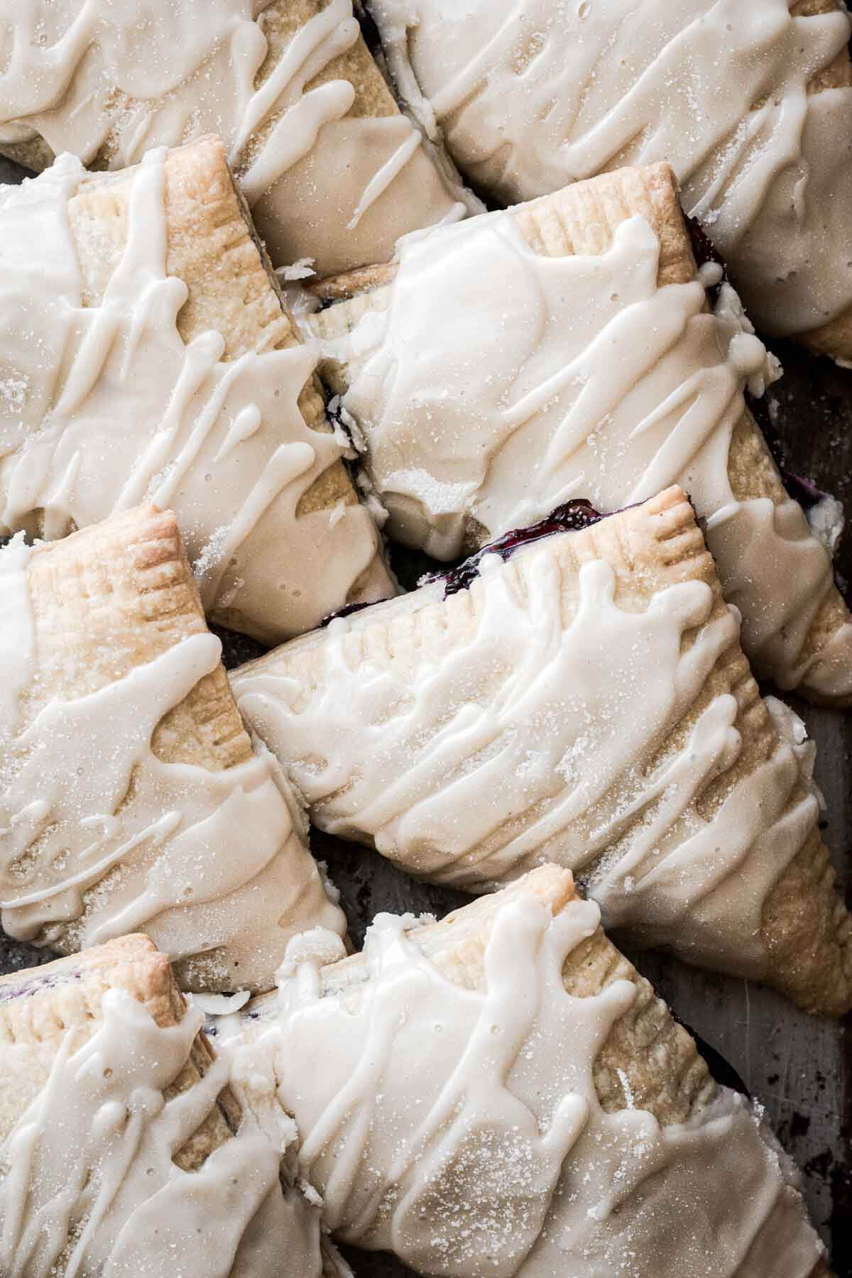 Blueberry turnovers with vanilla icing.