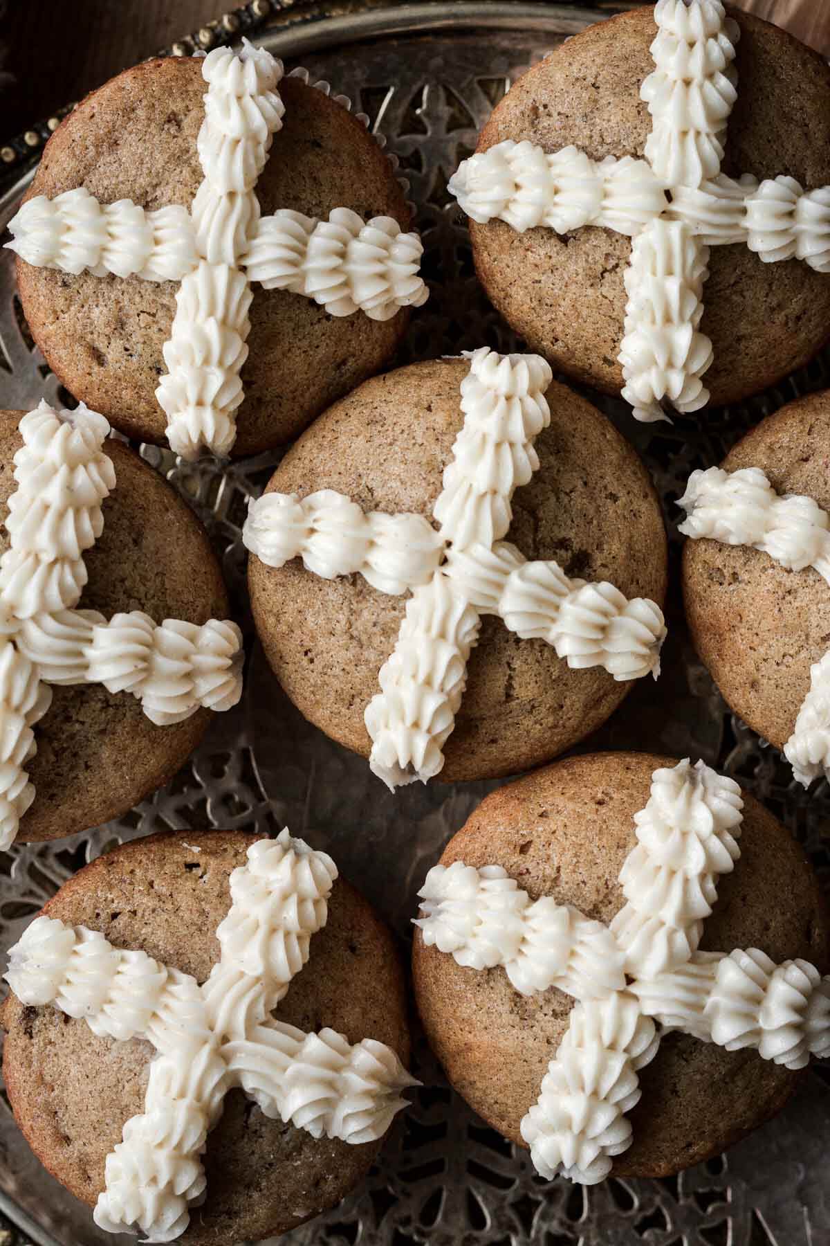 Hot cross muffins with a buttercream cross piped on top.