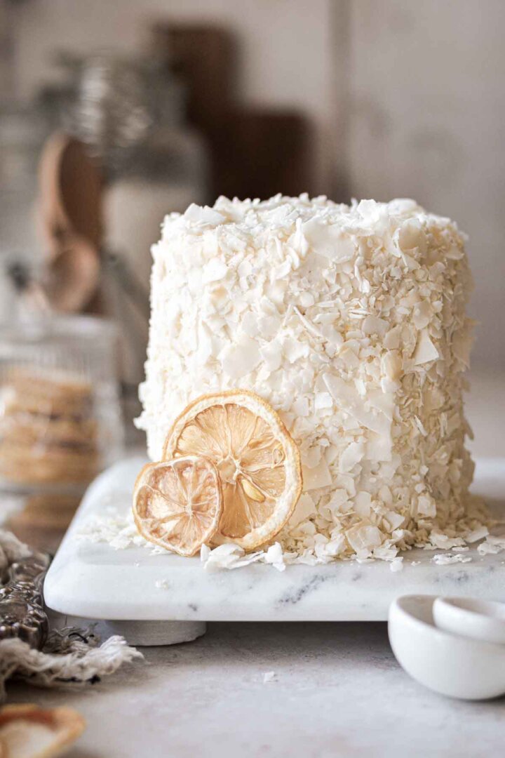 Mini lemon cake covered in coconut flakes.