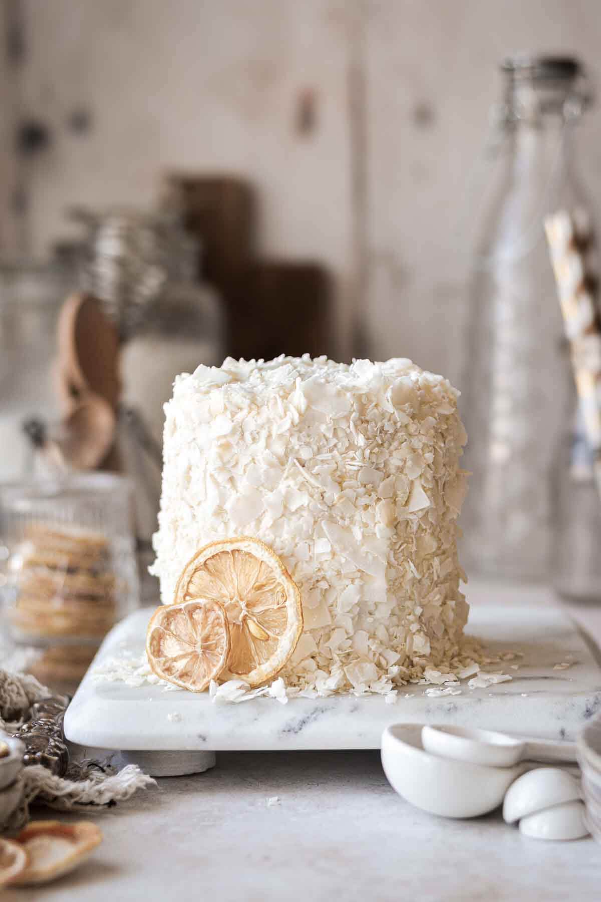 Mini lemon coconut cake with dried lemon slices.