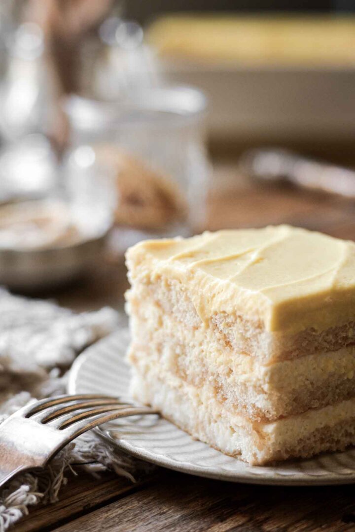 A piece of lemon tiramisu on a plate.