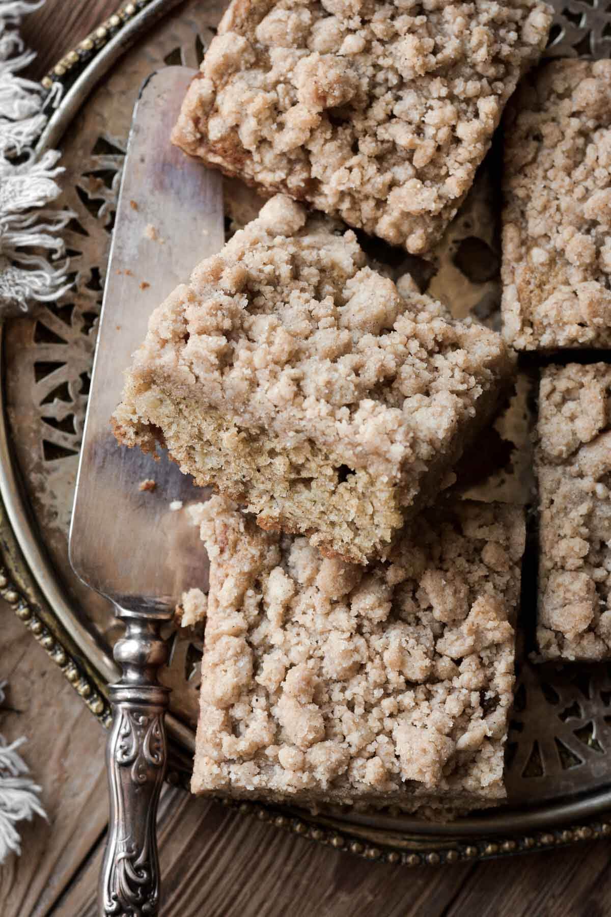 Squares of banana bread crumb cake.