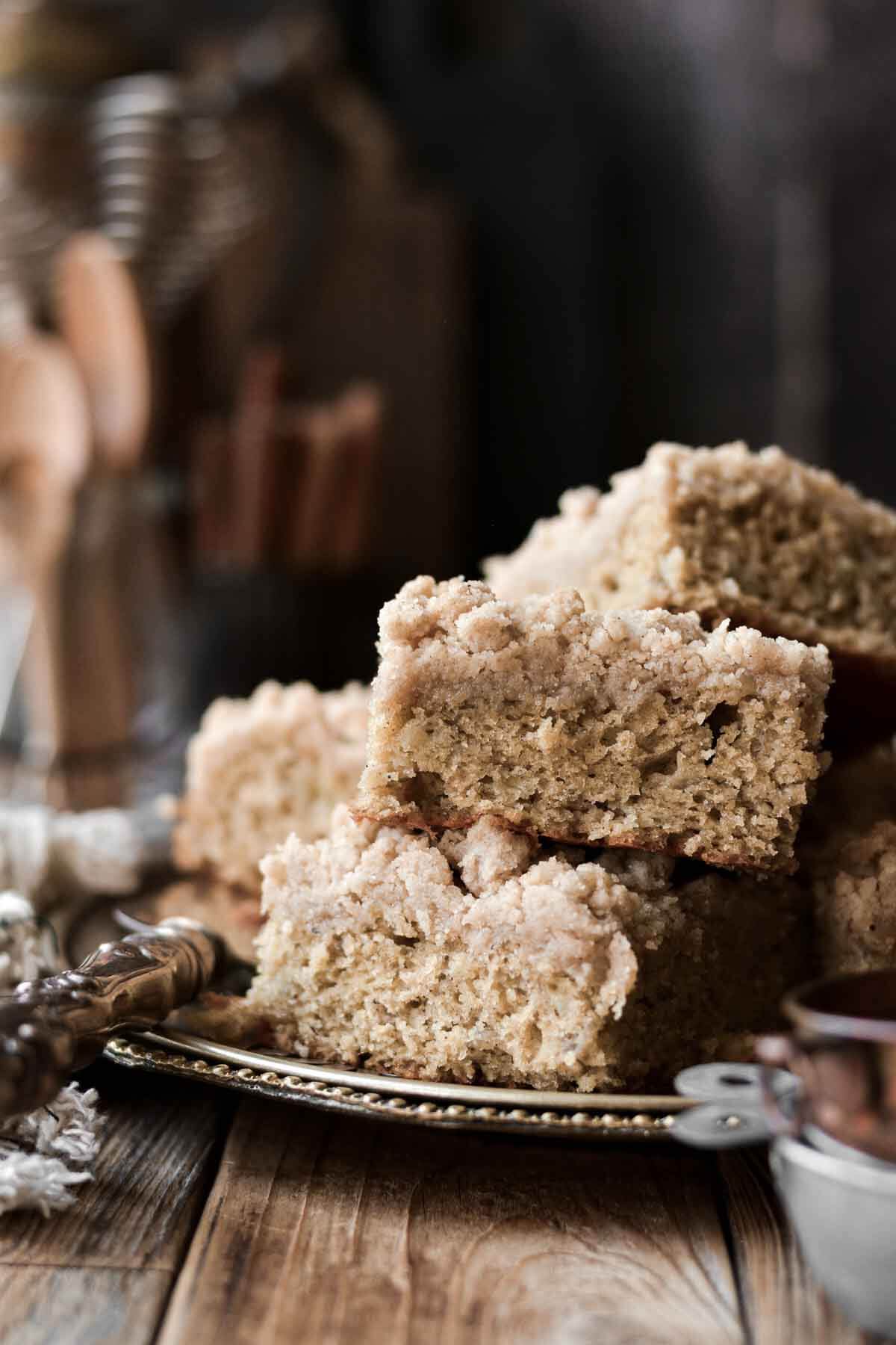 Banana bread crumb cake stacked on a plate.