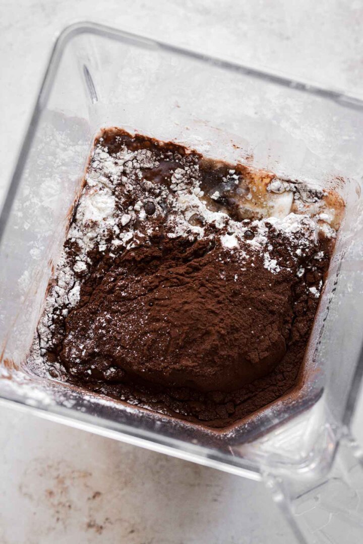 Ingredients for chocolate crepe batter in a blender.