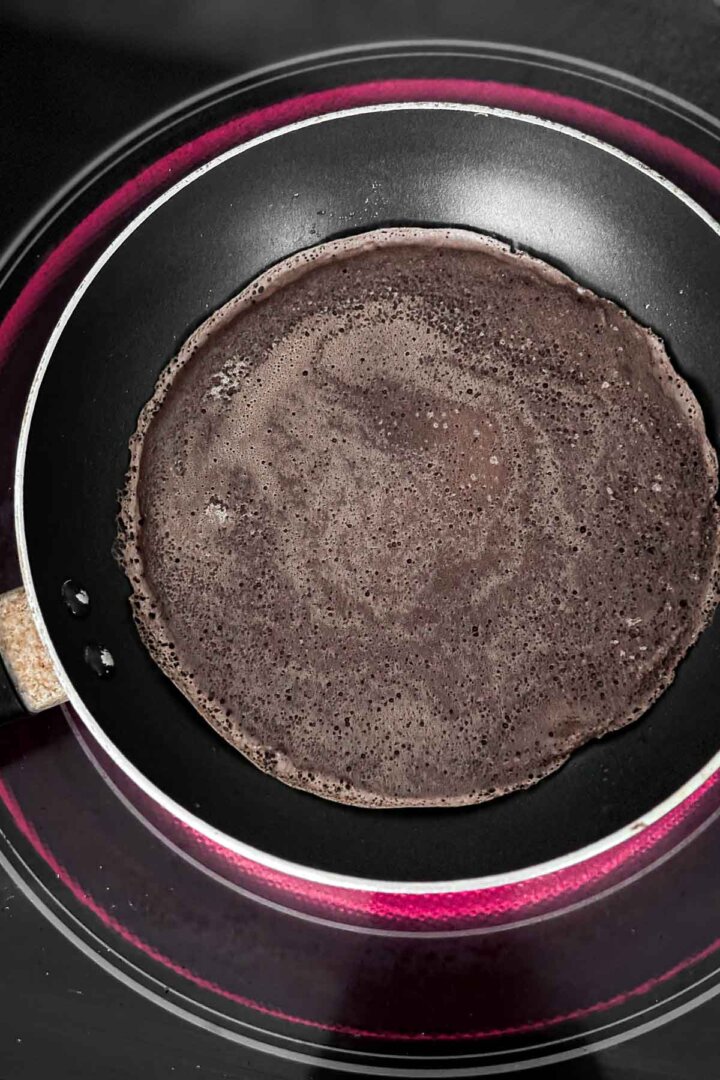 Chocolate crepe in a skillet.