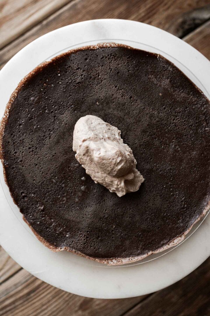 Step 1 for assembling a chocolate crepe cake.
