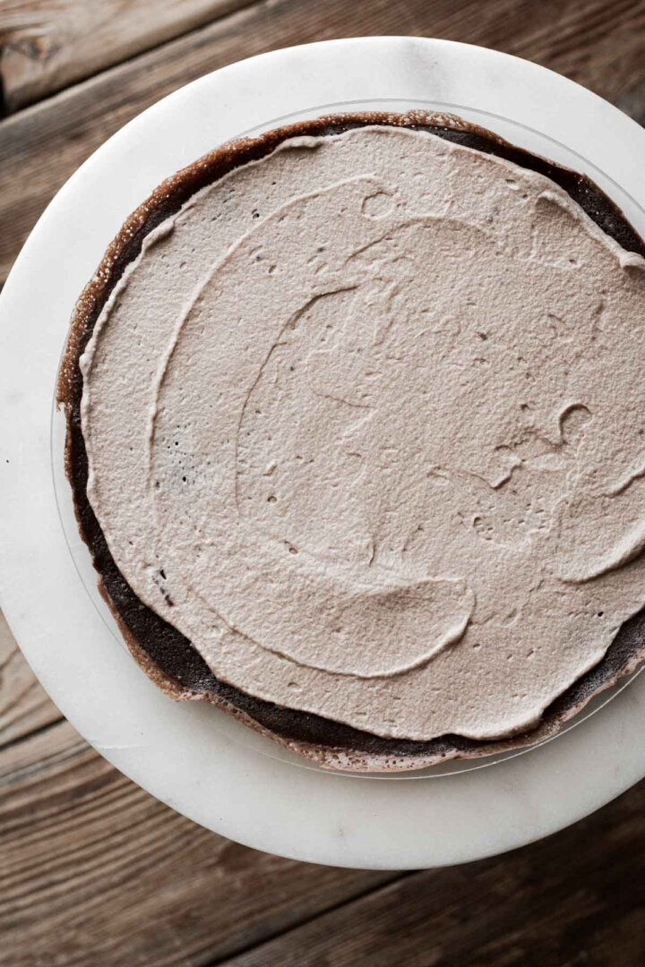 Step 2 for assembling a chocolate crepe cake.
