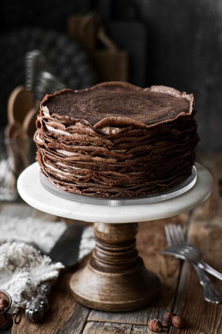 Step 3 for assembling a chocolate crepe cake.