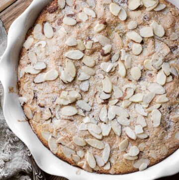 Sliced almonds sprinkled on top of a Swedish visiting cake.