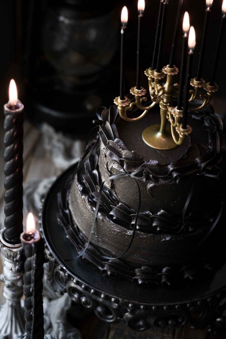 Black velvet cake in a moody, gothic scene.