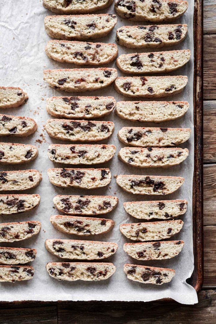 Step 8 for making cherry chocolate chip biscotti - biscotti cut into pieces and baked again.