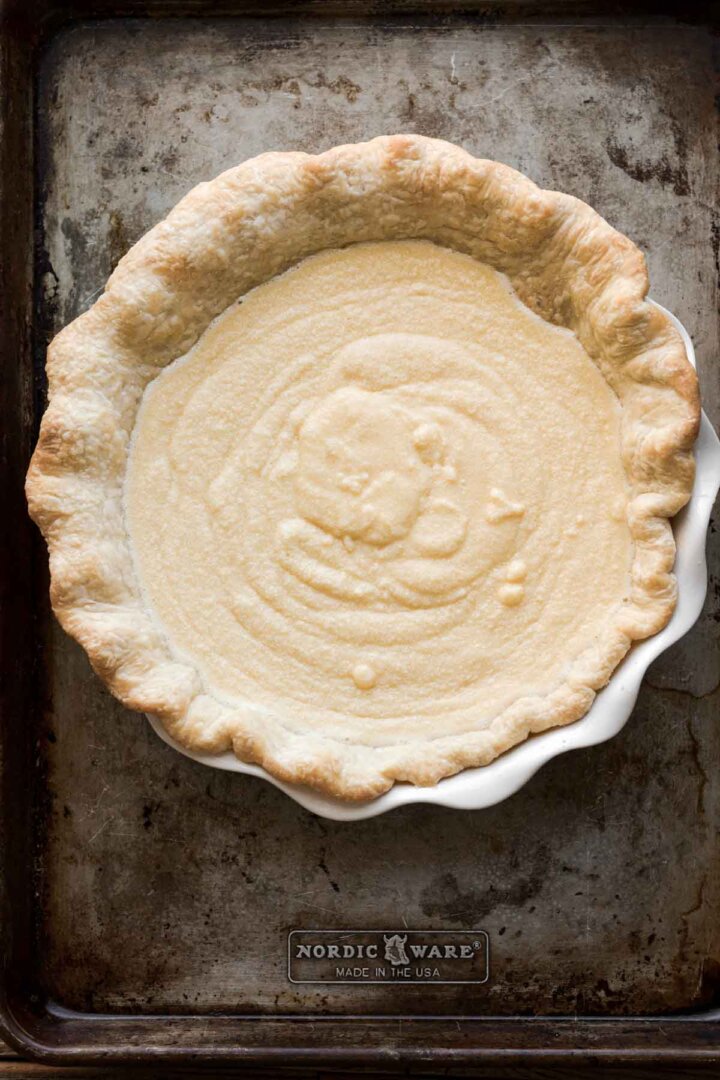 Step 8 for making chess pie - filling in the crust.