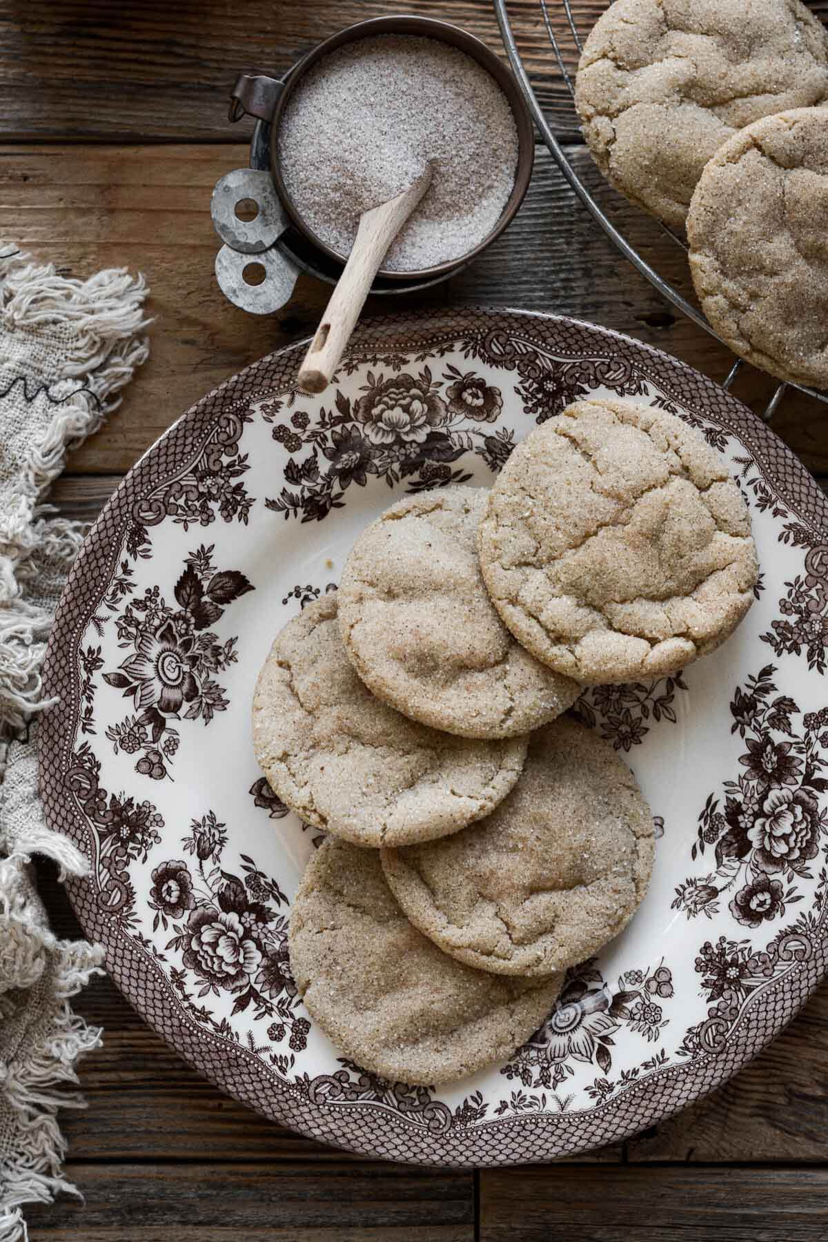 Maple cookies on a flowered plate.