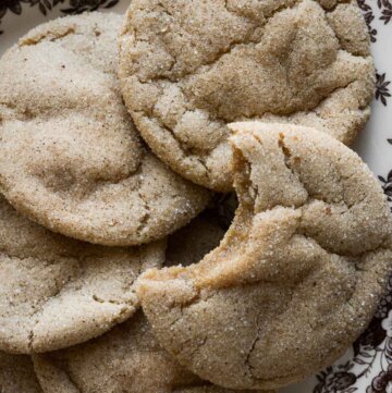 Soft maple cookies, one with a bite taken.
