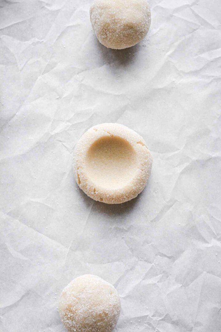 Step 3 for making pumpkin pie cookies - pressed dough ball.