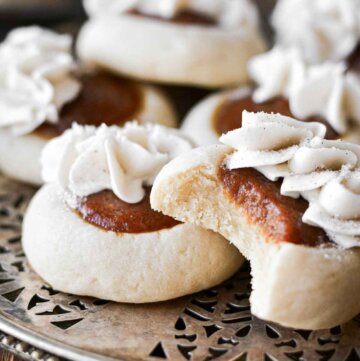 Pumpkin pie cookies, one with a bite taken.