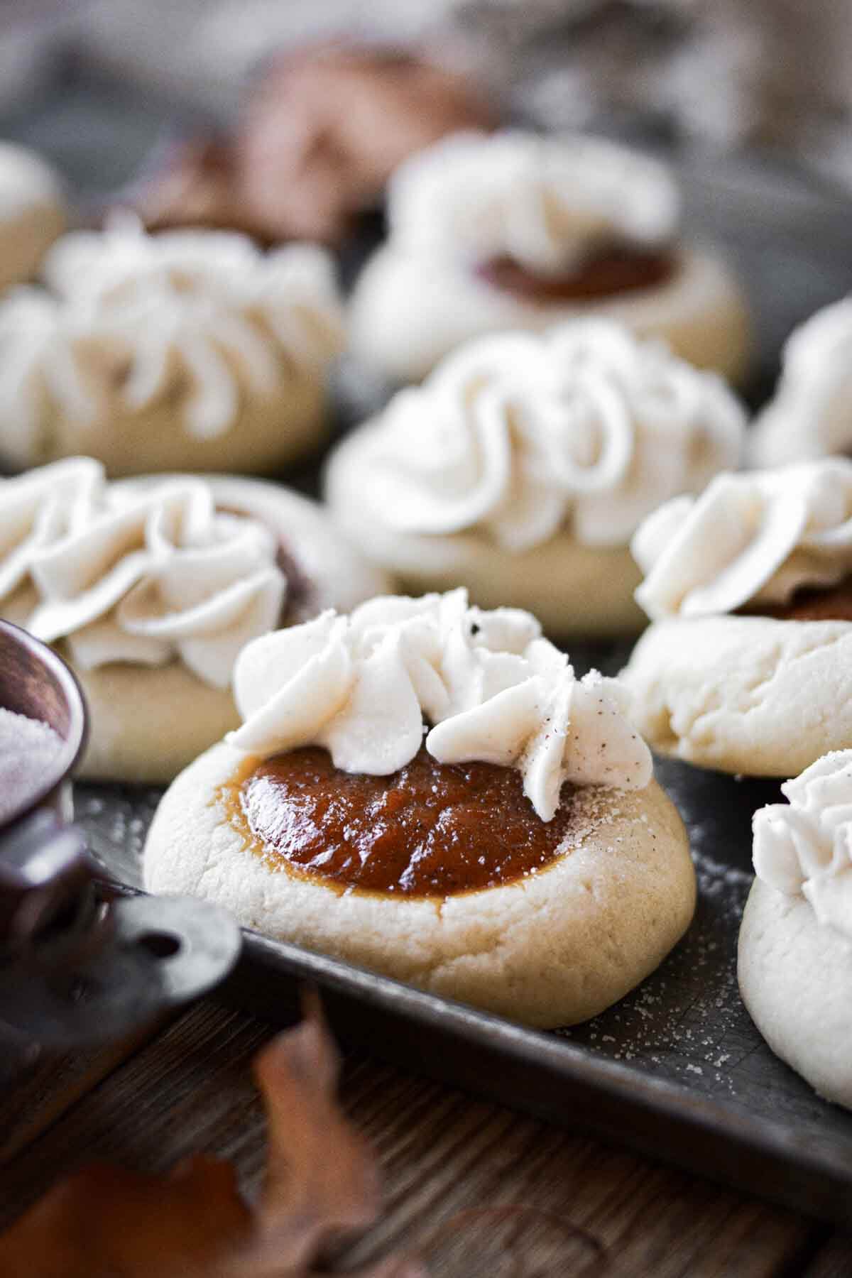 Pumpkin pie cookies with vanilla buttercream piping.