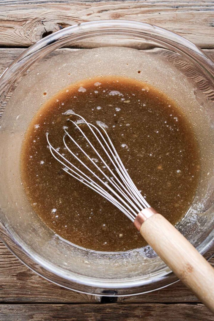 Step 2 for making walnut pie - whisking liquid ingredients.