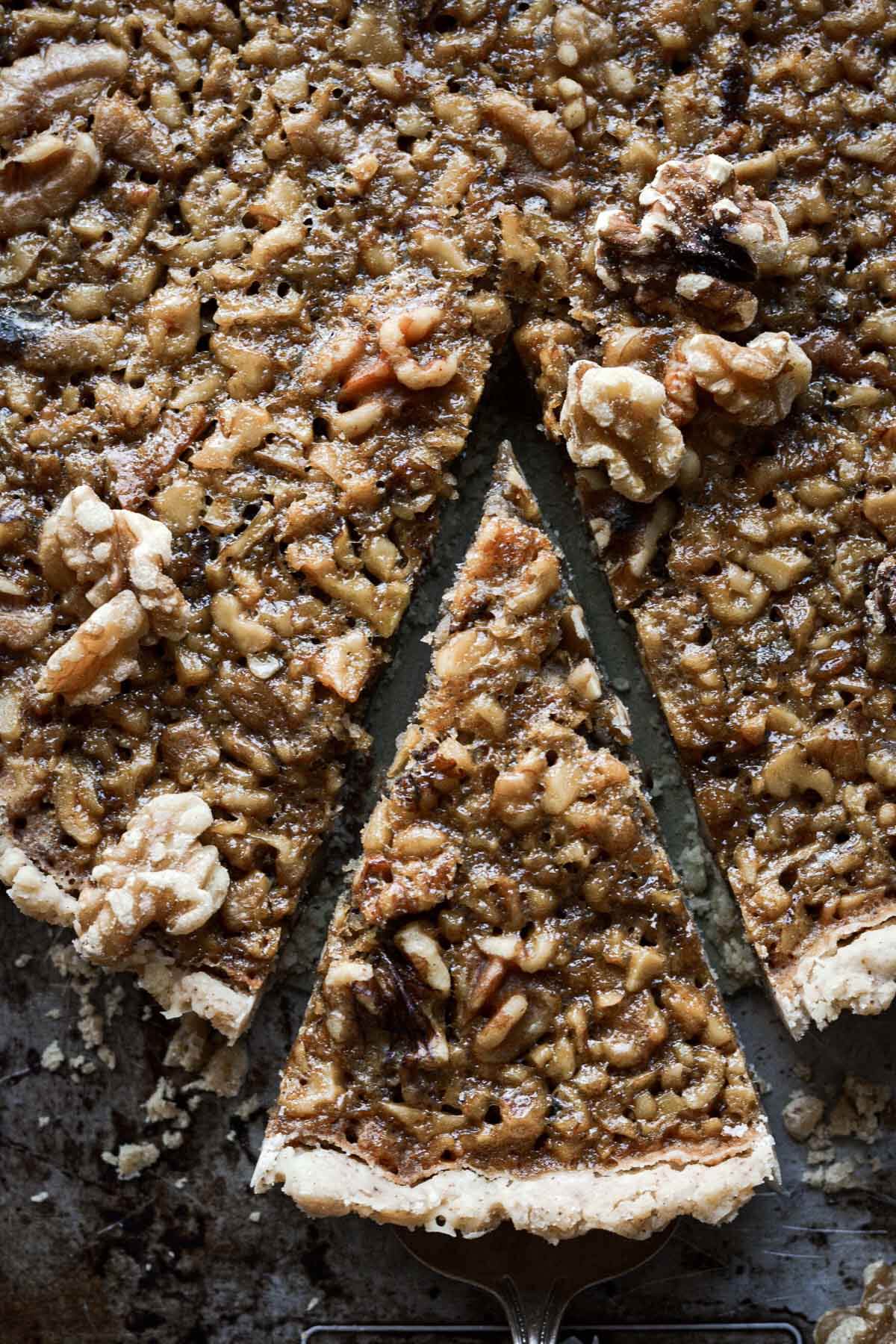 Walnut pie with a slice cut.