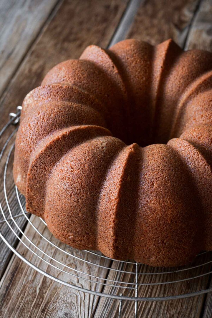 Eggnog bundt cake on a cooling rack.