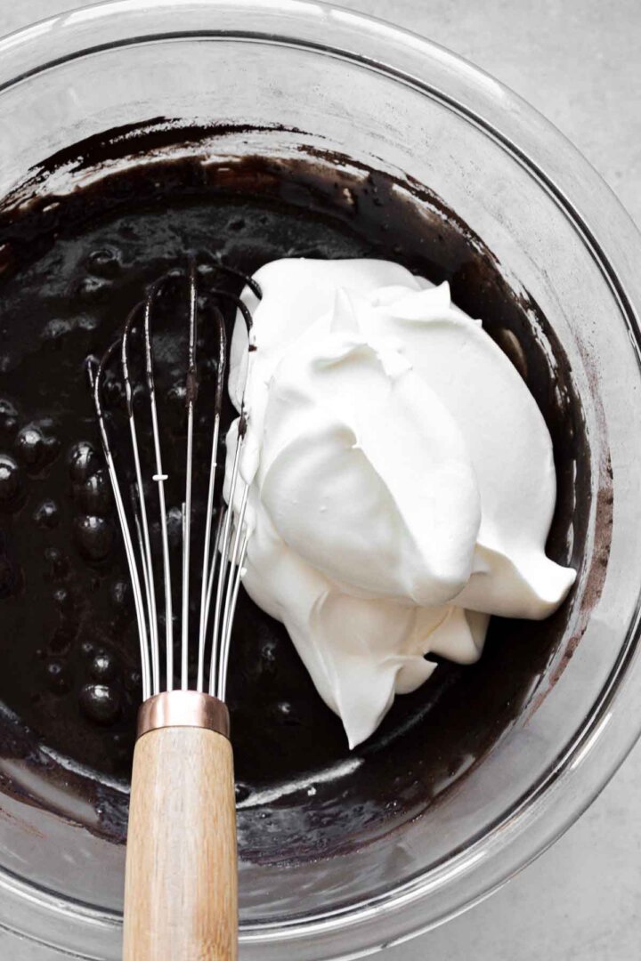 Step 3 for making chocolate peppermint ice cream - adding whipped cream.