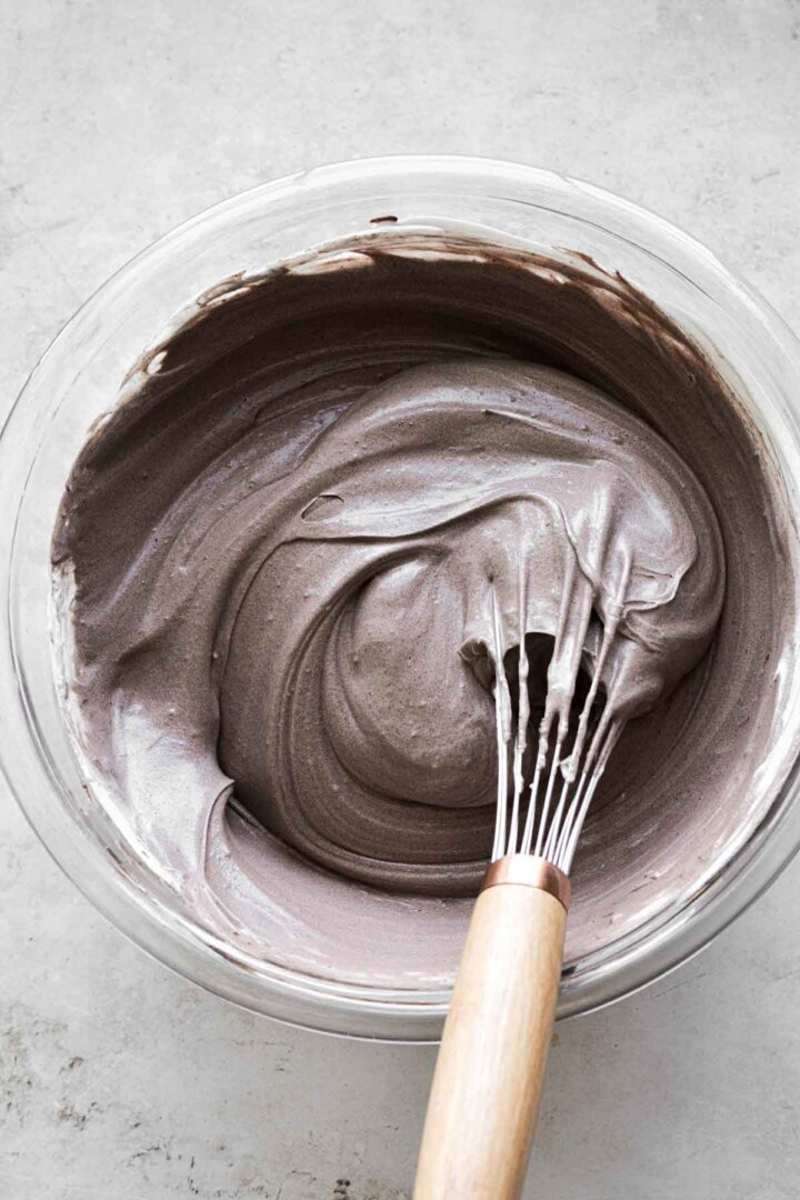 Step 4 for making chocolate peppermint ice cream - adding whipped cream.