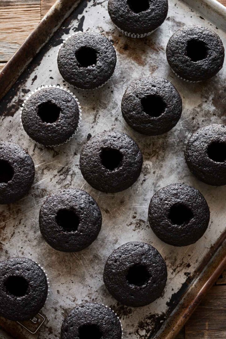Chocolate cupcakes with a hole in the center.