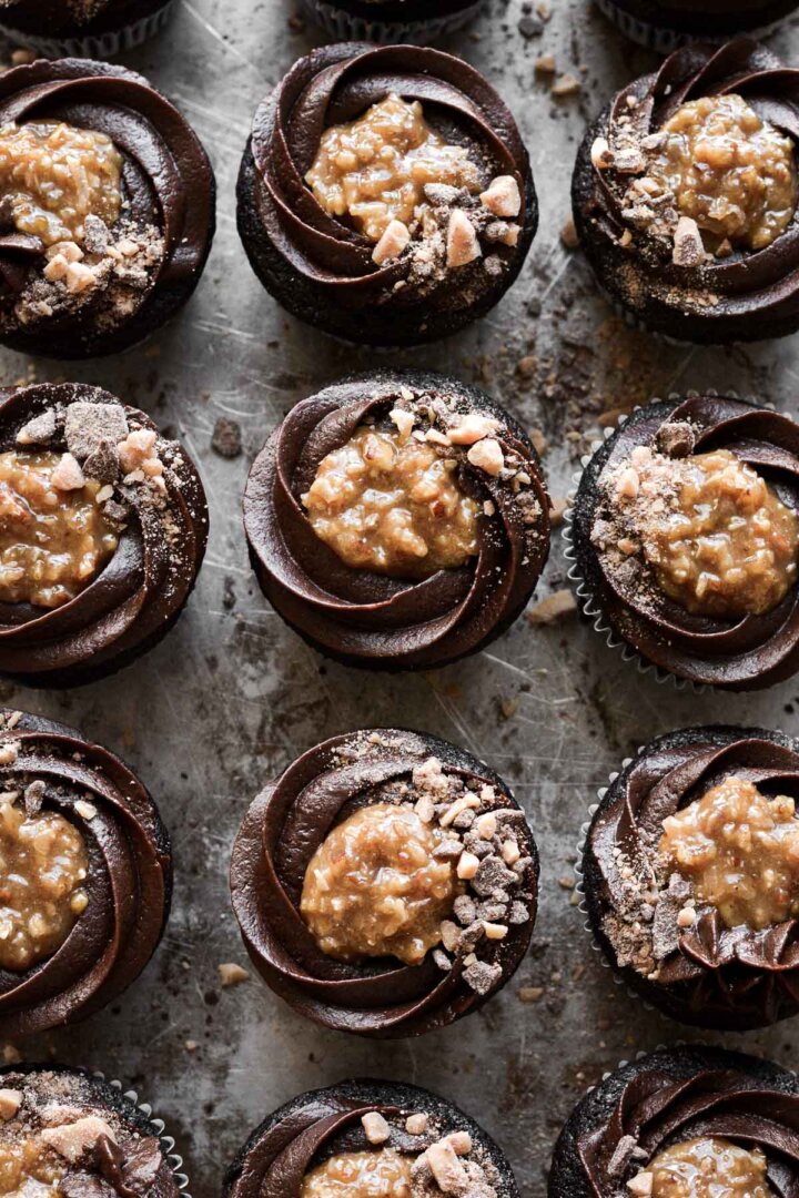 German chocolate cupcakes with chocolate buttercream, coconut caramel filling and toffee bits.