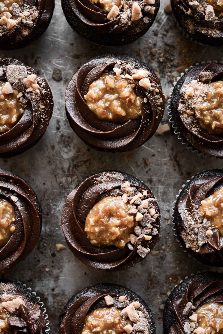 German chocolate cupcakes with chocolate buttercream, coconut caramel filling and toffee bits.