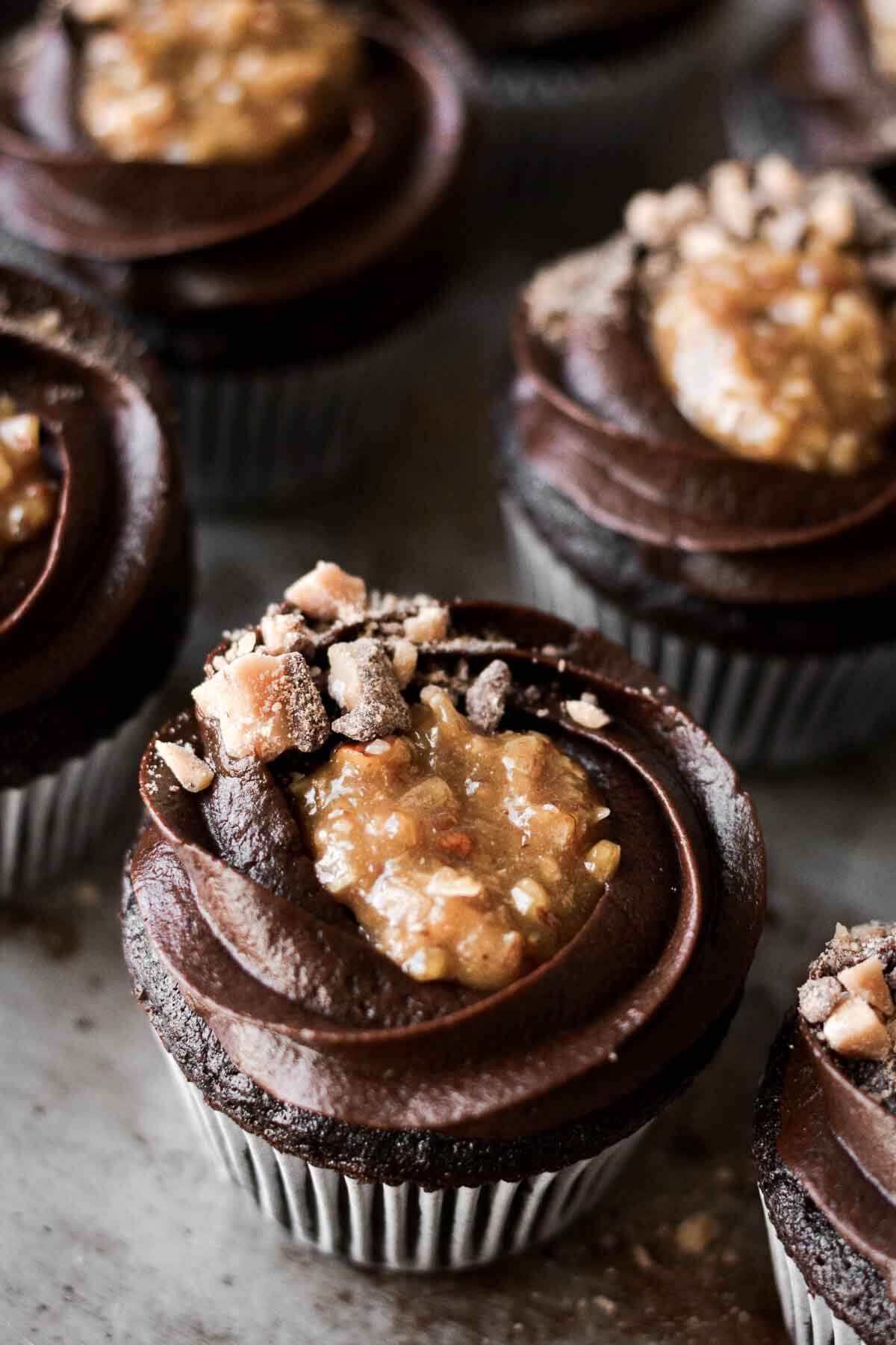 German chocolate cupcakes with chocolate buttercream, coconut caramel filling and toffee bits.