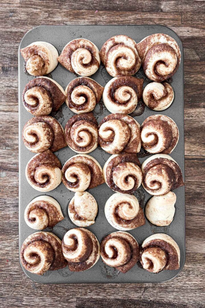 Mini cinnamon rolls baked in a mini muffin pan.