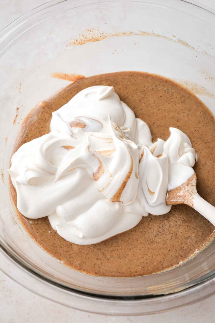 Step 3 for making coffee ice cream - adding whipped cream.