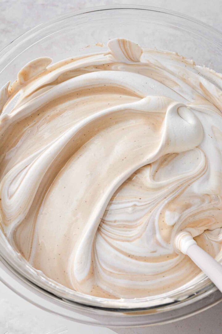 Step 4 for making coffee ice cream - adding whipped cream.