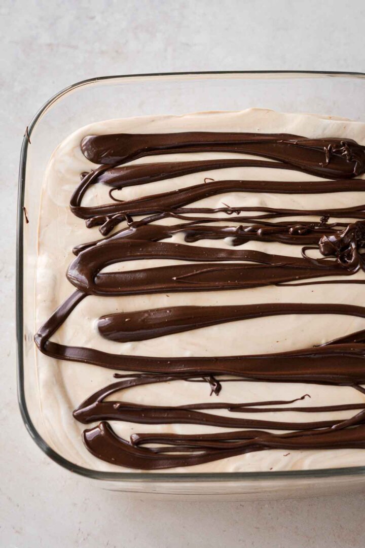 Step 5 for making coffee ice cream - swirling in chocolate.