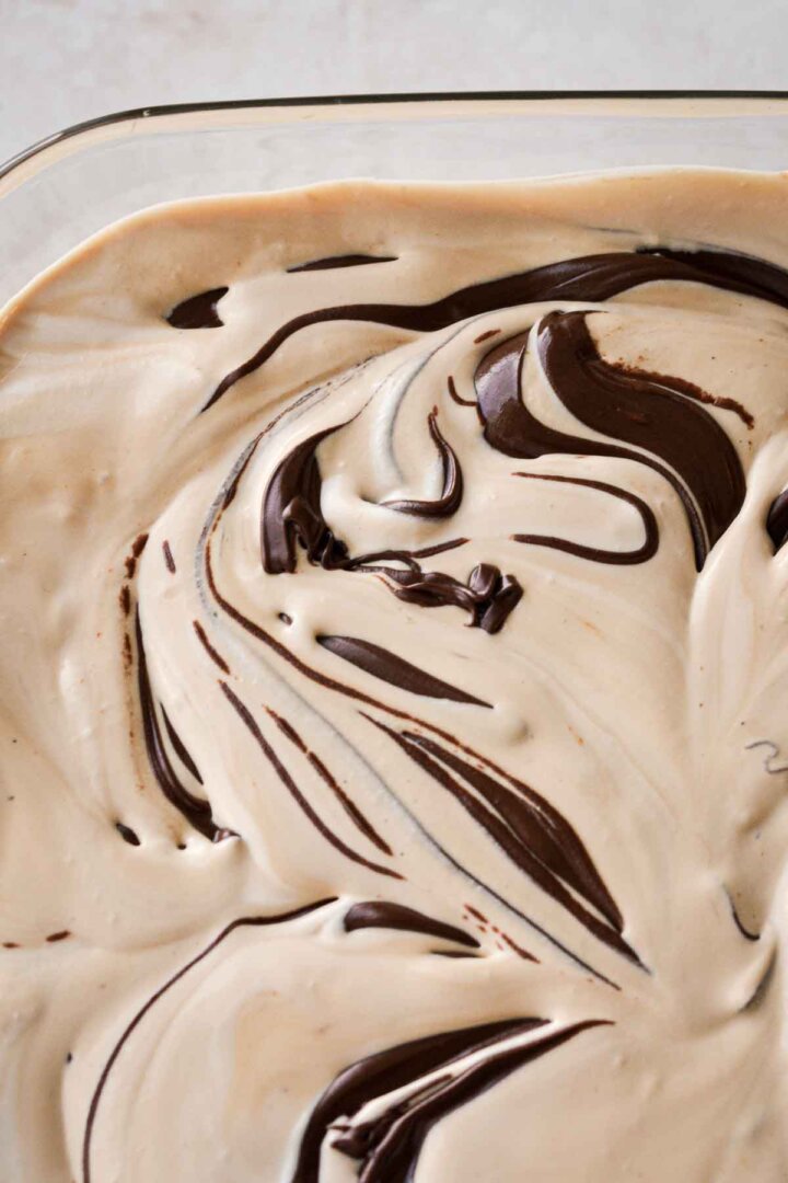 Step 6 for making coffee ice cream - swirling in chocolate.