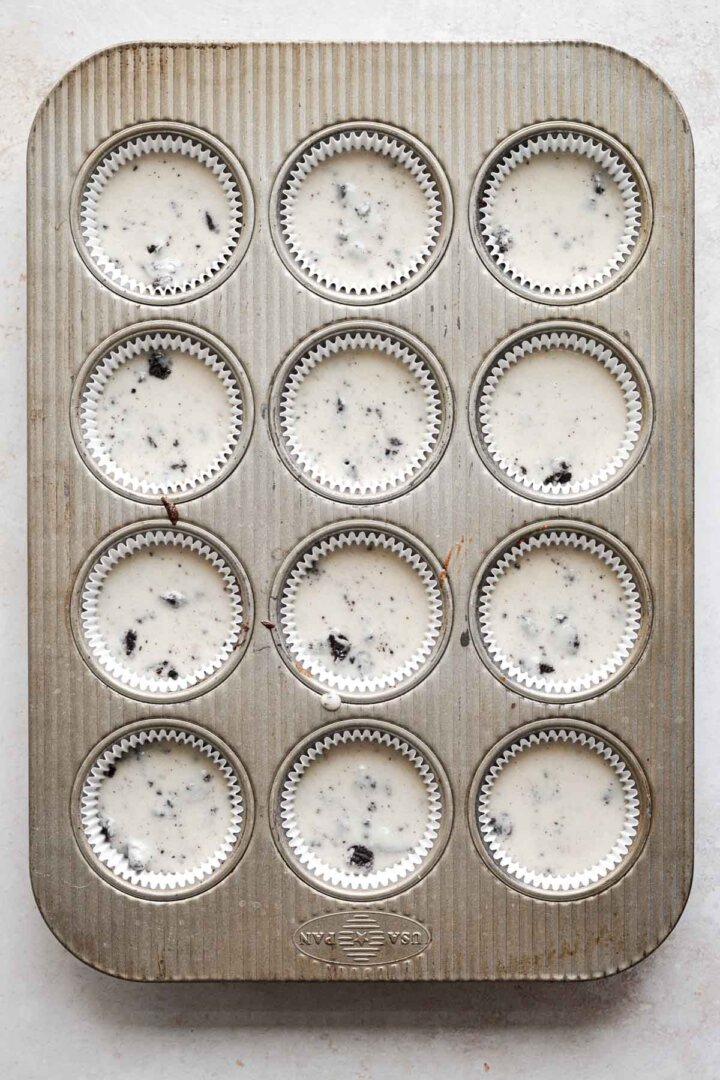 Cookies and cream cupcake batter in a pan.