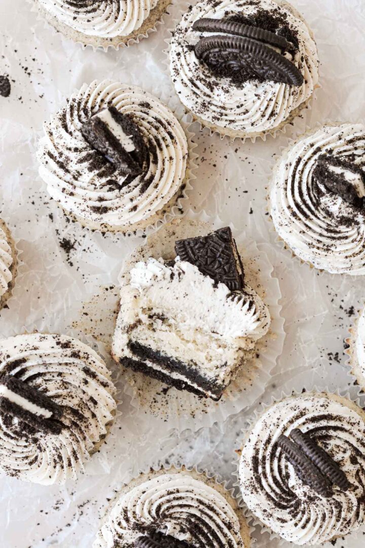 Cookies and cream cupcakes, one cut in half.