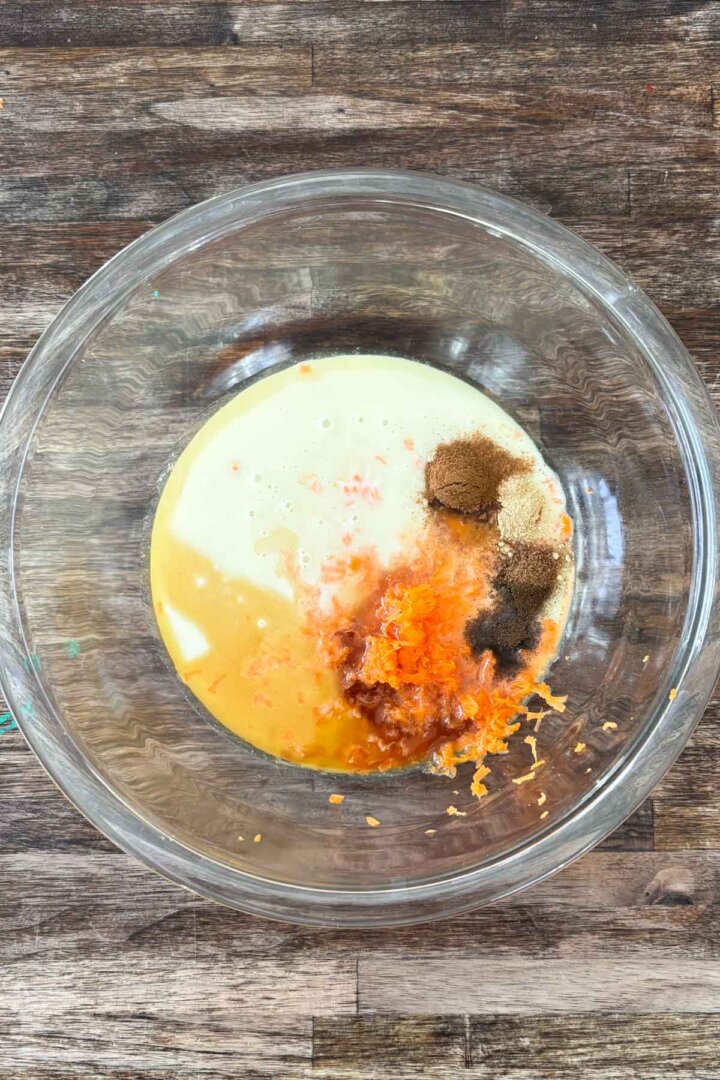 Step 1 for making carrot cake ice cream - whisking carrots, spices and milk.