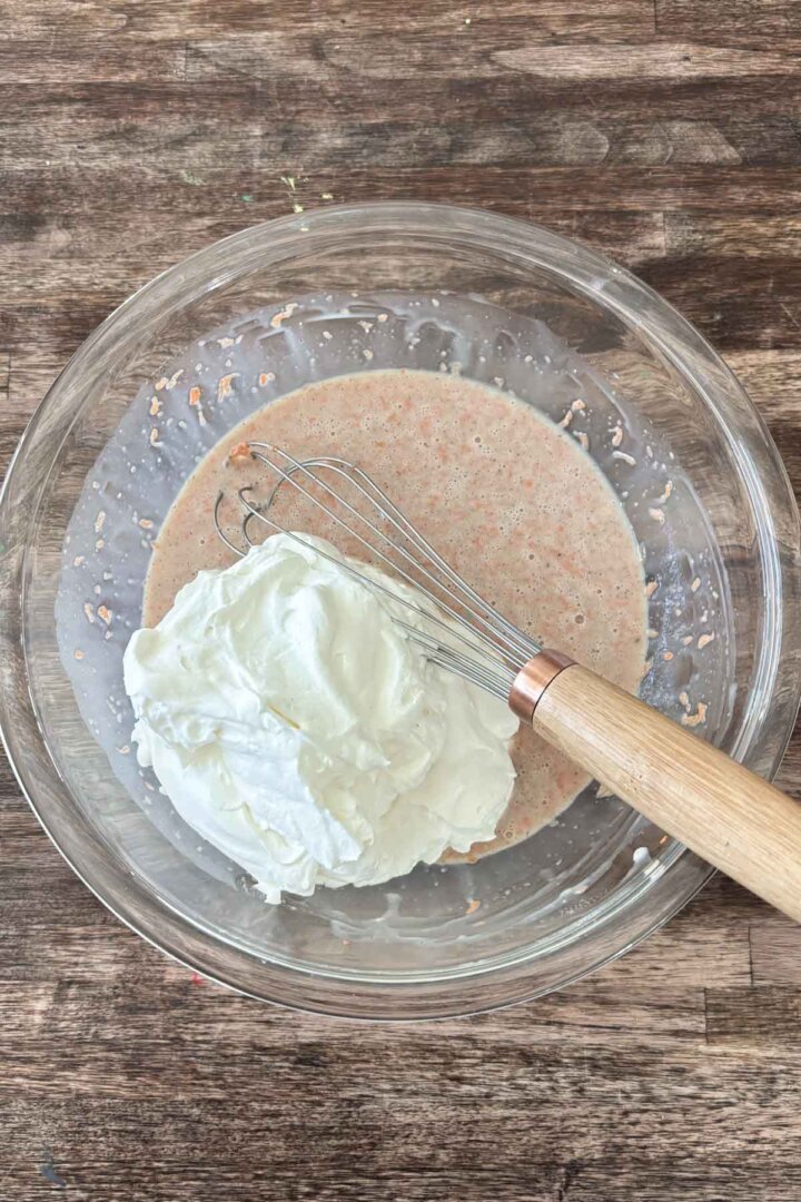 Step 3 for making carrot cake ice cream - adding whipped cream.