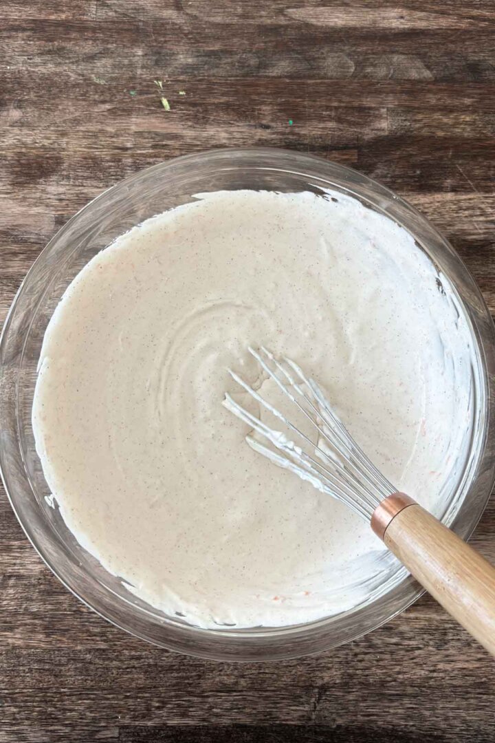 Step 4 for making carrot cake ice cream - adding whipped cream.
