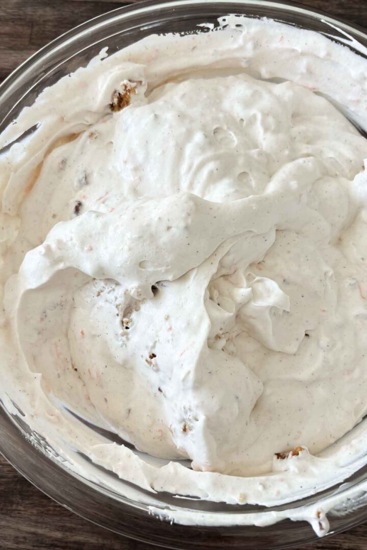 Step 7 for making carrot cake ice cream - adding crumbled cake.