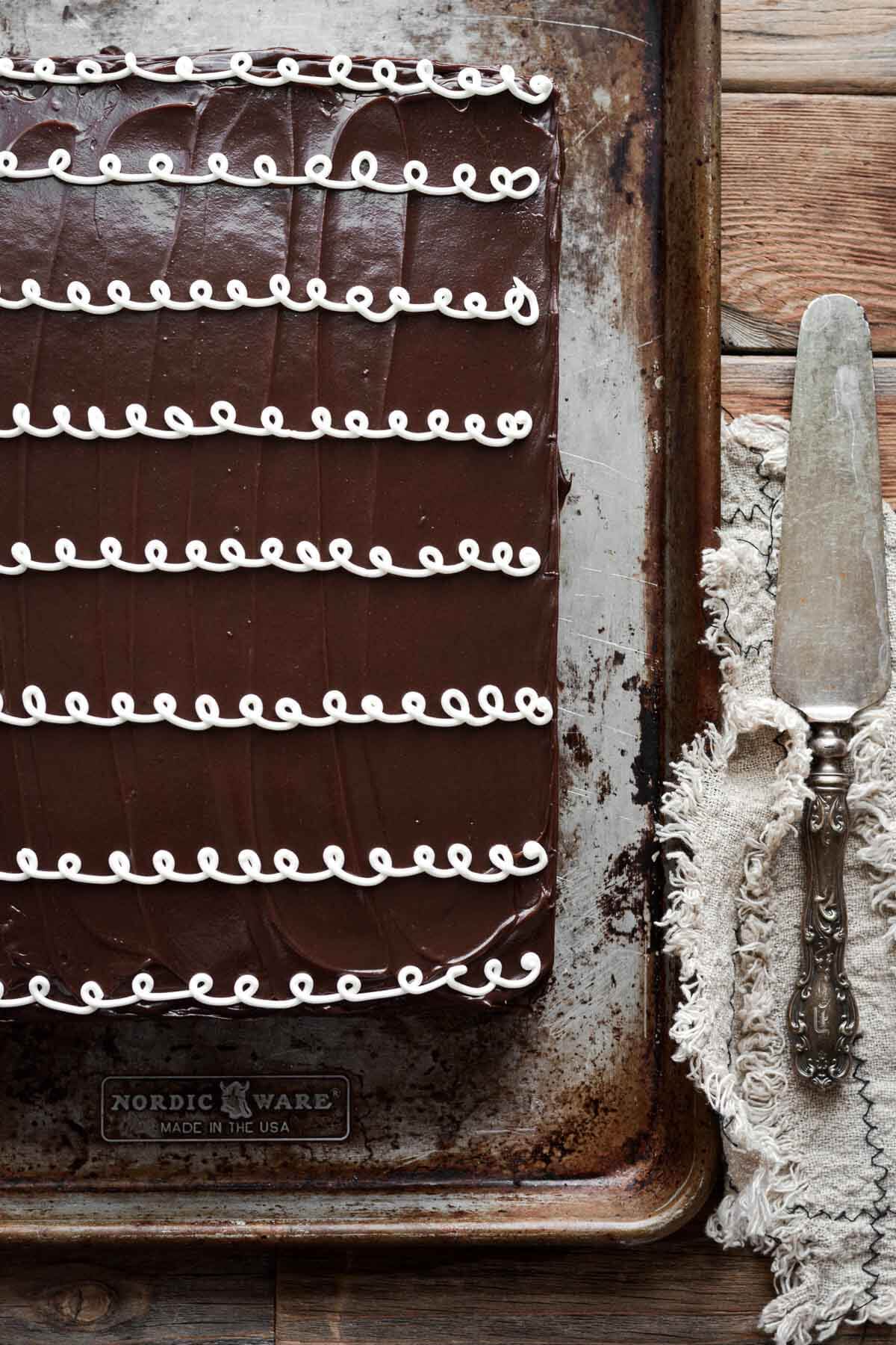 Chocolate hostess sheet cake on a baking sheet.