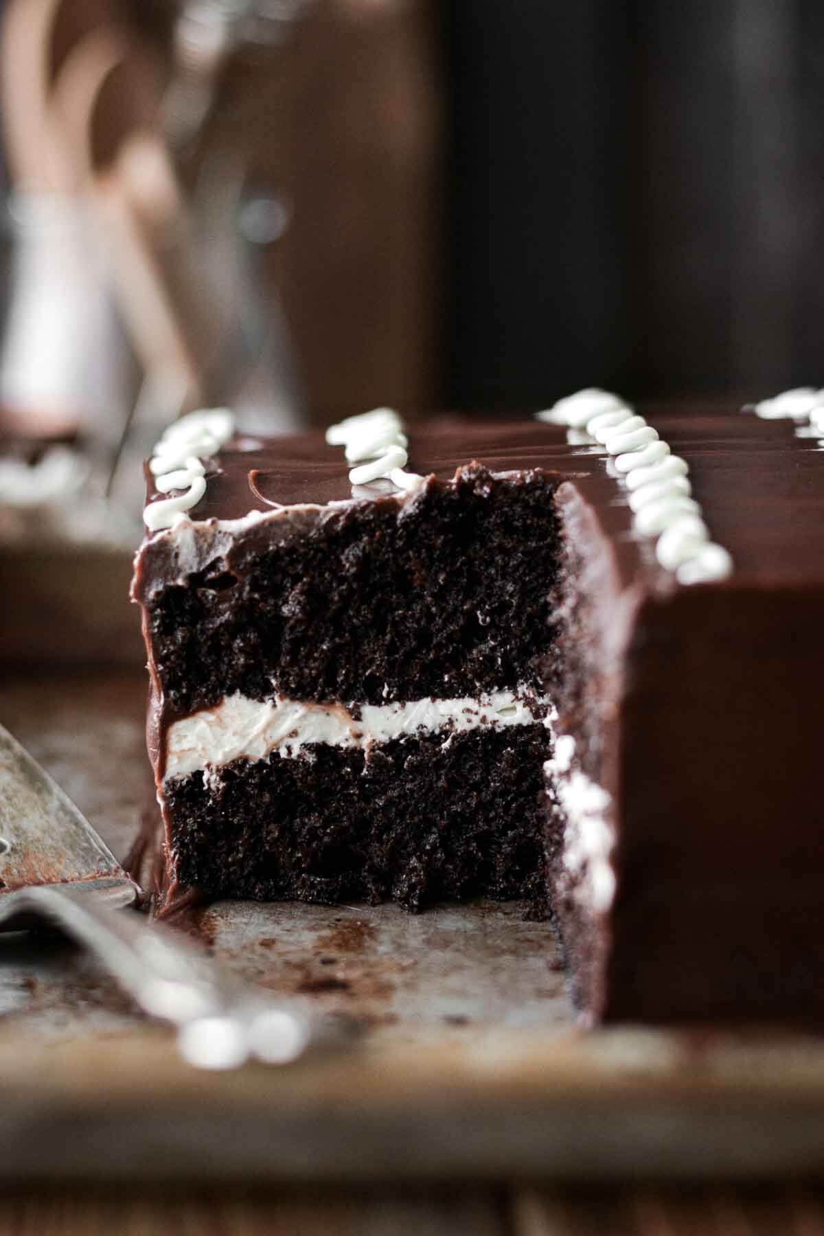 Chocolate hostess cake with a slice cut.