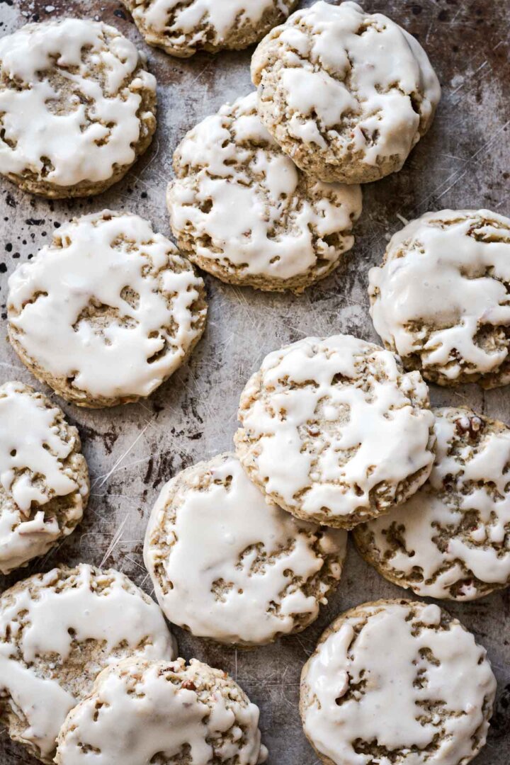 Earl grey tea cookies with lemon icing on a baking sheet.