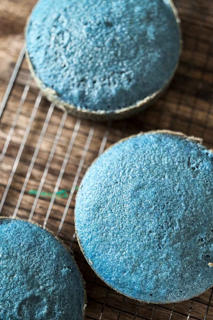 Blue cakes on a cooling rack.