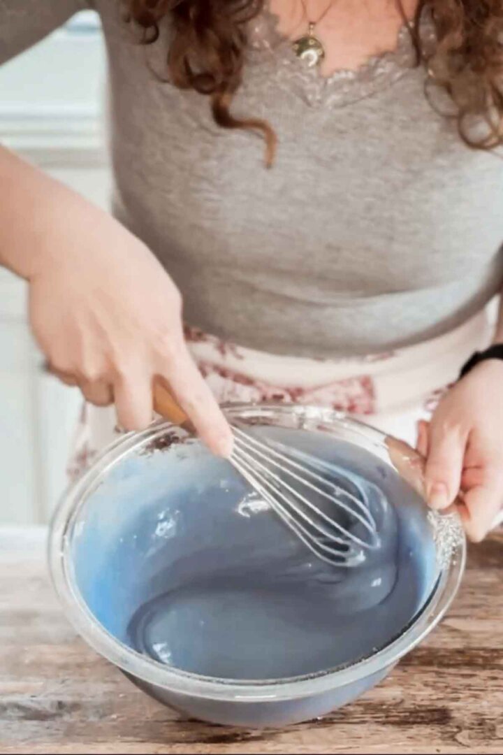 Whisking blue cake batter.